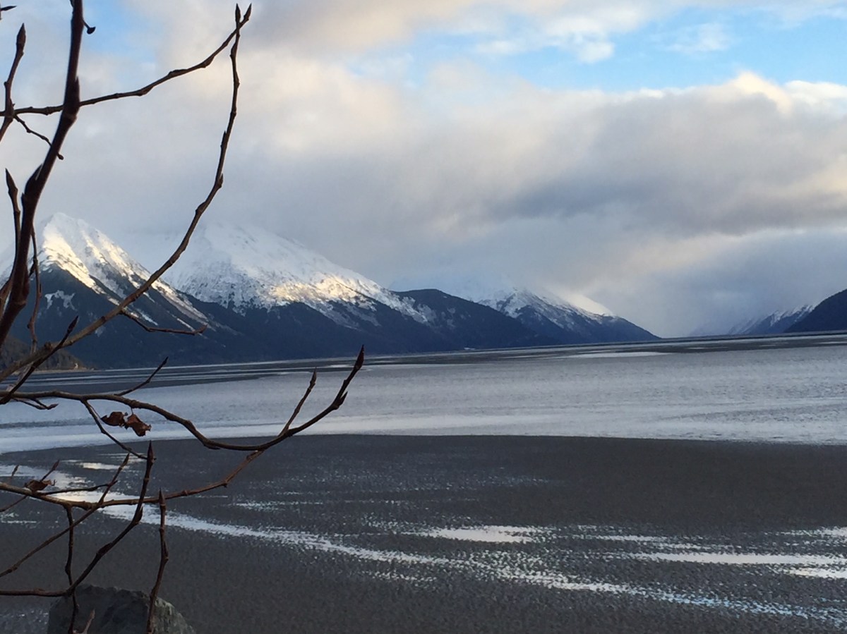 Alaskan mountain with lake and clouds